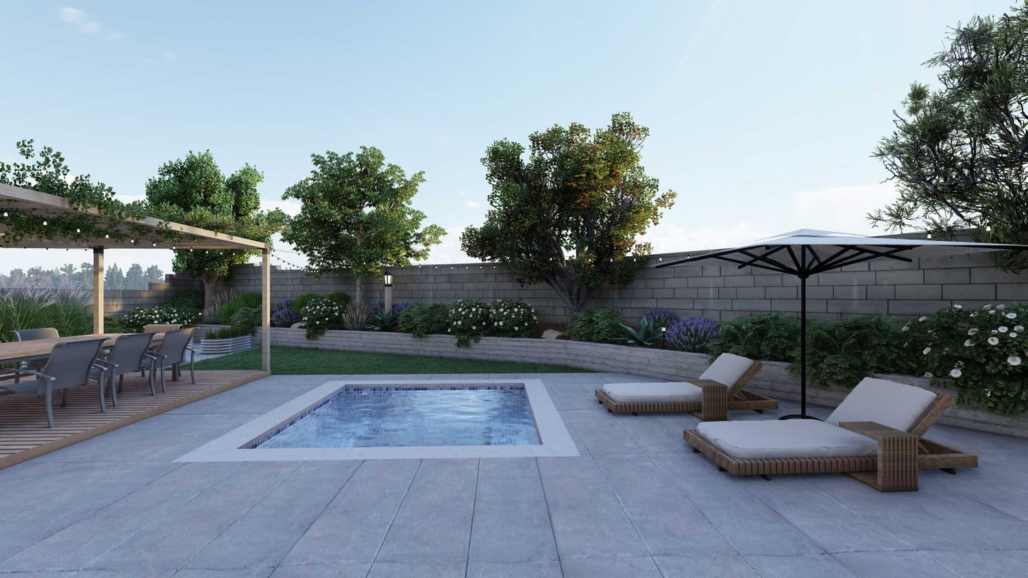 Thousand Oaks in-ground pool with concrete paver deck with lounge area in in fenced backyard beautified with flowers